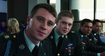 Movie still from “Billy Lynn's Long Halftime Walk” (2016), directed by Ang Lee – Two men in military uniforms posing for a picture; Close Up shot, Low angle