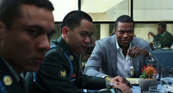 Movie still from “Billy Lynn's Long Halftime Walk” (2016), directed by Ang Lee – A group of men sitting around a table; Close Up shot, Over the shoulder angle