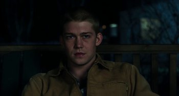 Movie still from “Billy Lynn's Long Halftime Walk” (2016), directed by Ang Lee – A young man in a brown jacket looking at the camera; Close Up shot, Low angle