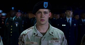 Movie still from “Billy Lynn's Long Halftime Walk” (2016), directed by Ang Lee – A man in a military uniform wearing a beret; Close Up shot, Low angle