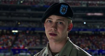 Movie still from “Billy Lynn's Long Halftime Walk” (2016), directed by Ang Lee – A man in a military uniform wearing a hat; Close Up shot, Low angle