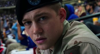 Movie still from “Billy Lynn's Long Halftime Walk” (2016), directed by Ang Lee – A man in a military uniform is looking at the camera; Close Up shot, Low angle