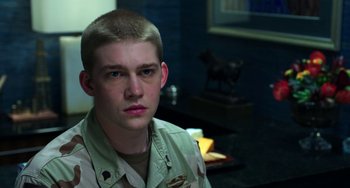 Movie still from “Billy Lynn's Long Halftime Walk” (2016), directed by Ang Lee – A young man in a military uniform stares into the camera; Close Up shot, Over the shoulder angle
