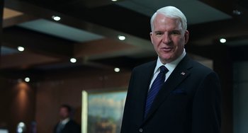 Movie still from “Billy Lynn's Long Halftime Walk” (2016), directed by Ang Lee – A man in a suit and a tie; Medium shot, Low angle