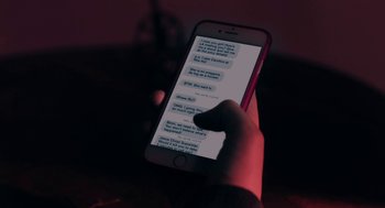 A person holding an iphone in their hand