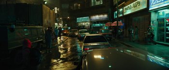 Movie still from “Black Adam” (2022), directed by Jaume Collet-Serra – Cars parked on the side of the street at night; Extreme Wide shot, High angle