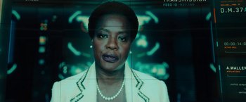 Movie still from “Black Adam” (2022), directed by Jaume Collet-Serra – A woman's face in front of a screen; Close Up shot, Low angle