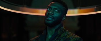 Movie still from “Black Adam” (2022), directed by Jaume Collet-Serra – A person with a beard looking up; Close Up shot, Low angle