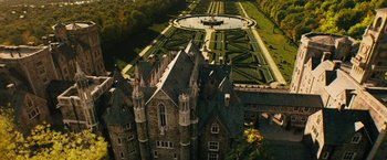 Movie still from “Black Adam” (2022), directed by Jaume Collet-Serra – An aerial view of a castle and a garden; Extreme Wide shot, Overhead angle