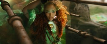 Movie still from “Black Adam” (2022), directed by Jaume Collet-Serra – A woman with long red hair and a green dress; Close Up shot, Low angle