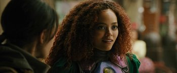 Movie still from “Black Adam” (2022), directed by Jaume Collet-Serra – A person with curly hair; Close Up shot, Over the shoulder angle