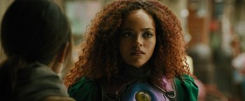 Movie still from “Black Adam” (2022), directed by Jaume Collet-Serra – A person with curly hair; Close Up shot, Over the shoulder angle