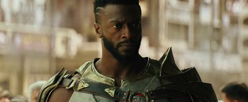 Movie still from “Black Adam” (2022), directed by Jaume Collet-Serra – A person wearing a costume; Close Up shot, Low angle