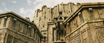 Movie still from “Black Adam” (2022), directed by Jaume Collet-Serra – An image of an old building in the middle of the day; Extreme Wide shot, Low angle