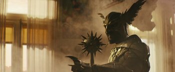 Movie still from “Black Adam” (2022), directed by Jaume Collet-Serra – A person holding a spear; Medium shot, Low angle