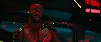 Movie still from “Black Adam” (2022), directed by Jaume Collet-Serra – A person wearing a costume; Close Up shot, Over the shoulder angle