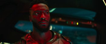 Movie still from “Black Adam” (2022), directed by Jaume Collet-Serra – A person wearing a helmet looking up; Close Up shot, Low angle