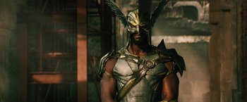 Movie still from “Black Adam” (2022), directed by Jaume Collet-Serra – A man wearing a helmet and armor with a sword; Medium shot, Low angle