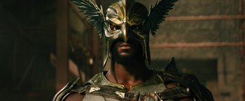 Movie still from “Black Adam” (2022), directed by Jaume Collet-Serra – A person wearing a helmet; Close Up shot, Low angle