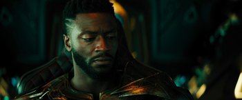 Movie still from “Black Adam” (2022), directed by Jaume Collet-Serra – A person with a beard; Close Up shot, Over the shoulder angle