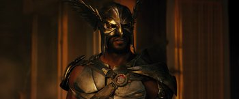 Movie still from “Black Adam” (2022), directed by Jaume Collet-Serra – A person wearing a costume; Close Up shot, Low angle