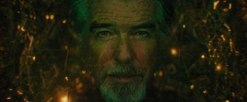 Movie still from “Black Adam” (2022), directed by Jaume Collet-Serra – A man's face with green leaves in the background; Close Up shot, Overhead angle