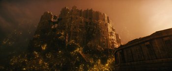 Movie still from “Black Adam” (2022), directed by Jaume Collet-Serra – A building that has a bunch of lights on it; Extreme Wide shot, Low angle
