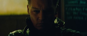 Movie still from “Black Mass” (2015), directed by Scott Cooper – A man's face in the dark; Close Up shot, Low angle