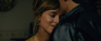 Movie still from “Black Mass” (2015), directed by Scott Cooper – A person with their eyes closed; Close Up shot, Over the shoulder angle