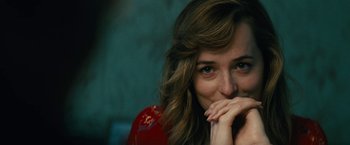 Movie still from “Black Mass” (2015), directed by Scott Cooper – A person with her hand on her chin; Close Up shot, Over the shoulder angle