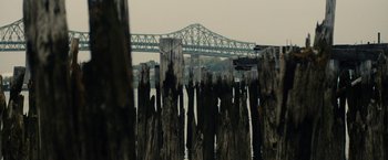 Movie still from “Black Mass” (2015), directed by Scott Cooper – A view of a bridge from across the water; Extreme Wide shot, High angle