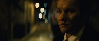 Movie still from “Black Mass” (2015), directed by Scott Cooper – A person wearing a suit and tie; Close Up shot, Low angle