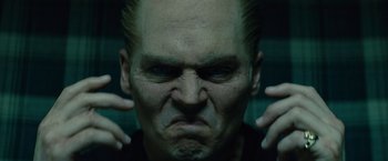 Movie still from “Black Mass” (2015), directed by Scott Cooper – A man's face with his hands on his head; Close Up shot, Low angle