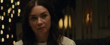 Movie still from “Black Mass” (2015), directed by Scott Cooper – A person with long brown hair; Close Up shot, Over the shoulder angle