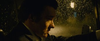Movie still from “Black Mass” (2015), directed by Scott Cooper – A person looking out of a window; Close Up shot, Low angle