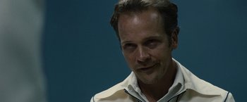 Movie still from “Black Mass” (2015), directed by Scott Cooper – A person wearing a white shirt; Close Up shot, Over the shoulder angle