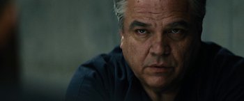 Movie still from “Black Mass” (2015), directed by Scott Cooper – An older man with gray hair stares at the camera; Close Up shot, Low angle