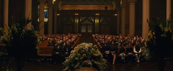Movie still from “Black Mass” (2015), directed by Scott Cooper – A large group of people sitting in front of an audience; Wide shot, High angle