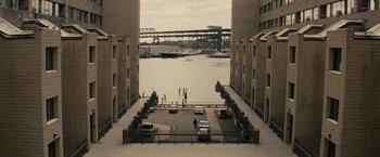Movie still from “Black Mass” (2015), directed by Scott Cooper – A view of a river and a bridge from a building; Extreme Wide shot, High angle
