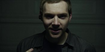 Movie still from “Blair Witch” (2016), directed by Adam Wingard – A person wearing a black shirt; Close Up shot, Overhead angle