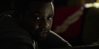 Movie still from “Blair Witch” (2016), directed by Adam Wingard – A man's face in the dark; Close Up shot, Over the shoulder angle