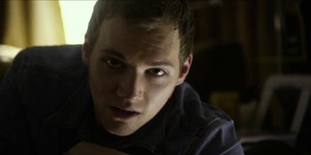 Movie still from “Blair Witch” (2016), directed by Adam Wingard – A person looking at the camera; Close Up shot, Low angle