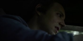 Movie still from “Blair Witch” (2016), directed by Adam Wingard – A man's face in the dark; Close Up shot, Over the shoulder angle