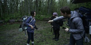 Movie still from “Blair Witch” (2016), directed by Adam Wingard – A group of people in the woods taking pictures of each other; Wide shot, Over the shoulder angle