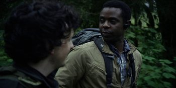 Movie still from “Blair Witch” (2016), directed by Adam Wingard – Two men talking to each other in the woods; Close Up shot, Over the shoulder angle