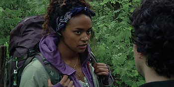 Movie still from “Blair Witch” (2016), directed by Adam Wingard – A woman with a purple bandana on her head; Close Up shot, Low angle