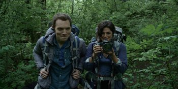Movie still from “Blair Witch” (2016), directed by Adam Wingard – A man and a woman hiking in the woods; Medium shot, Low angle