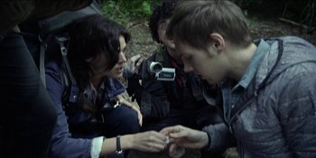 Movie still from “Blair Witch” (2016), directed by Adam Wingard – A group of people sitting on the ground; Close Up shot, Over the shoulder angle