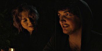 Movie still from “Blair Witch” (2016), directed by Adam Wingard – A man and a woman in a dark room; Close Up shot, Over the shoulder angle