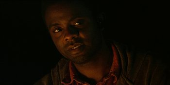 Movie still from “Blair Witch” (2016), directed by Adam Wingard – A person wearing a red shirt; Close Up shot, Over the shoulder angle